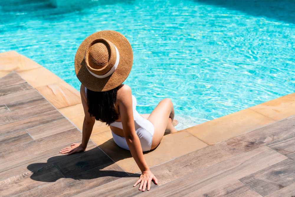 A resident relaxing near the swimming pool at Banyan Club East in Pompano Beach, Florida