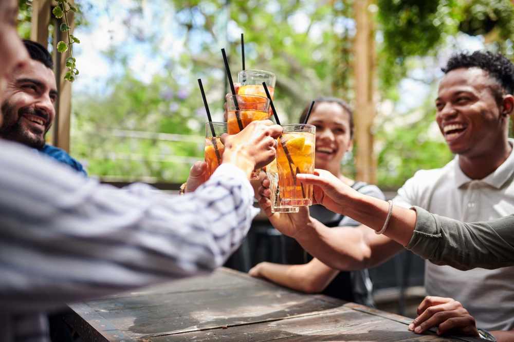 Residents enjoying drinks at their favorite restaurant near Highlands Creek Apartments in Dallas, Texas 