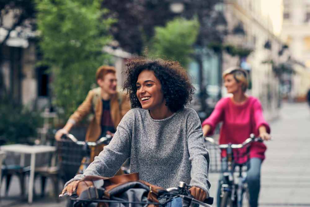 Residents enjoying bicycle ride in a street near James Towne Village in Charleston, South Carolina