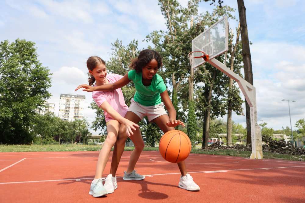 Residents playing with a balll in the playground near James Towne Village in Charleston, South Carolina
