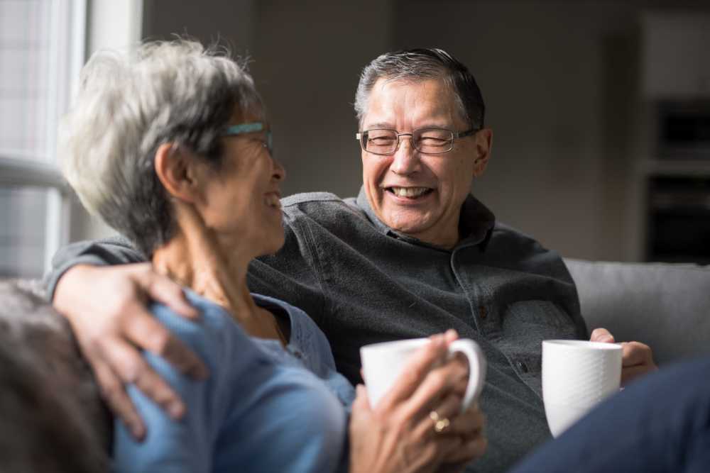 Residents having coffee in living room at Lihue Gardens Elderly in Lihue, Hawaii  