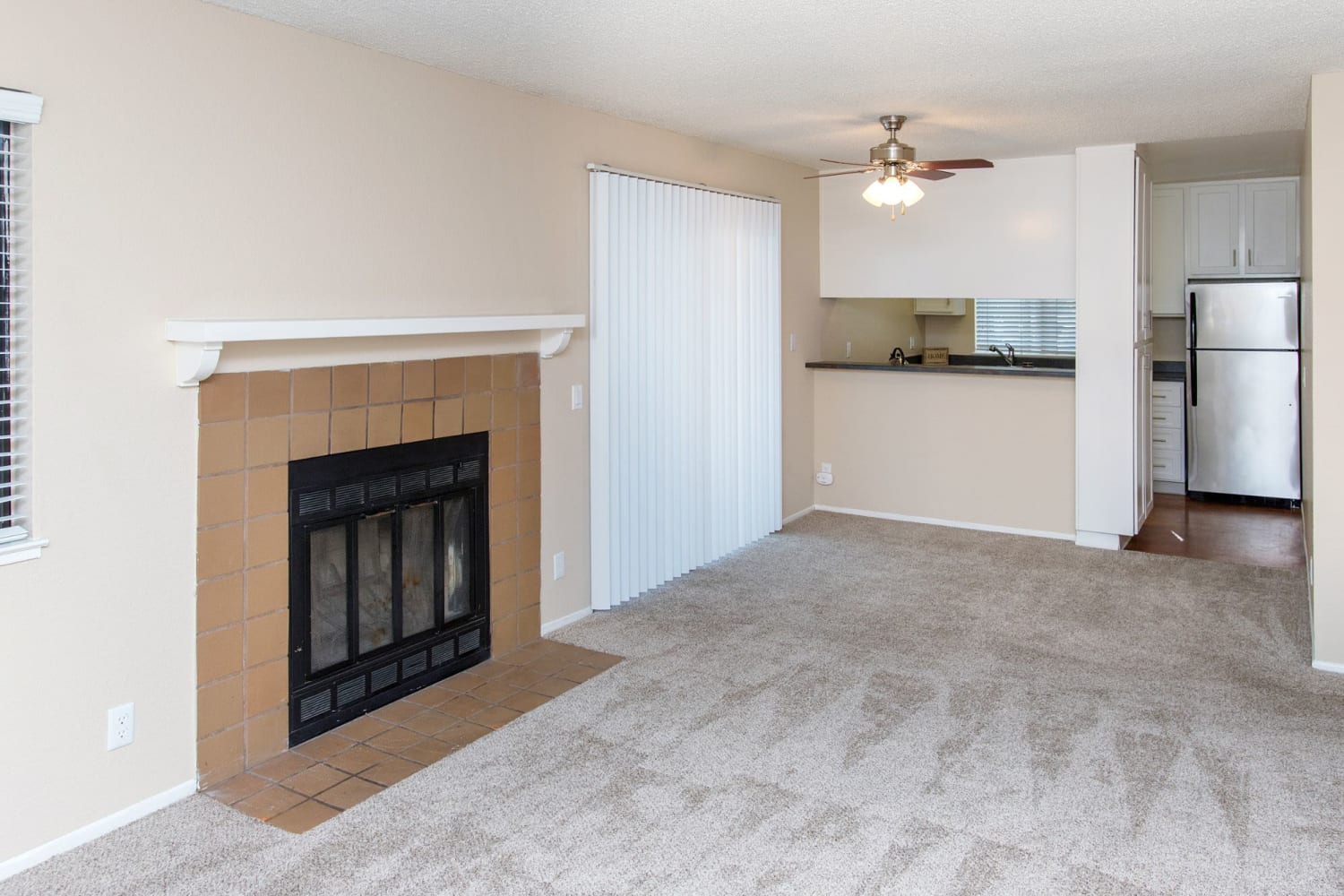 A fireplace in a beautiful open living room floor plan at Amber Court in Fremont, California