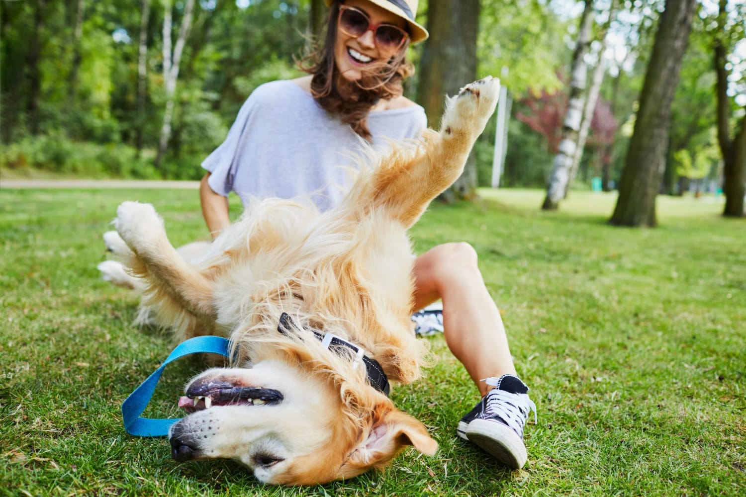 Resident playing with her dog at the dog park near Meridian Oaks Apartments in Greenwood, Indiana