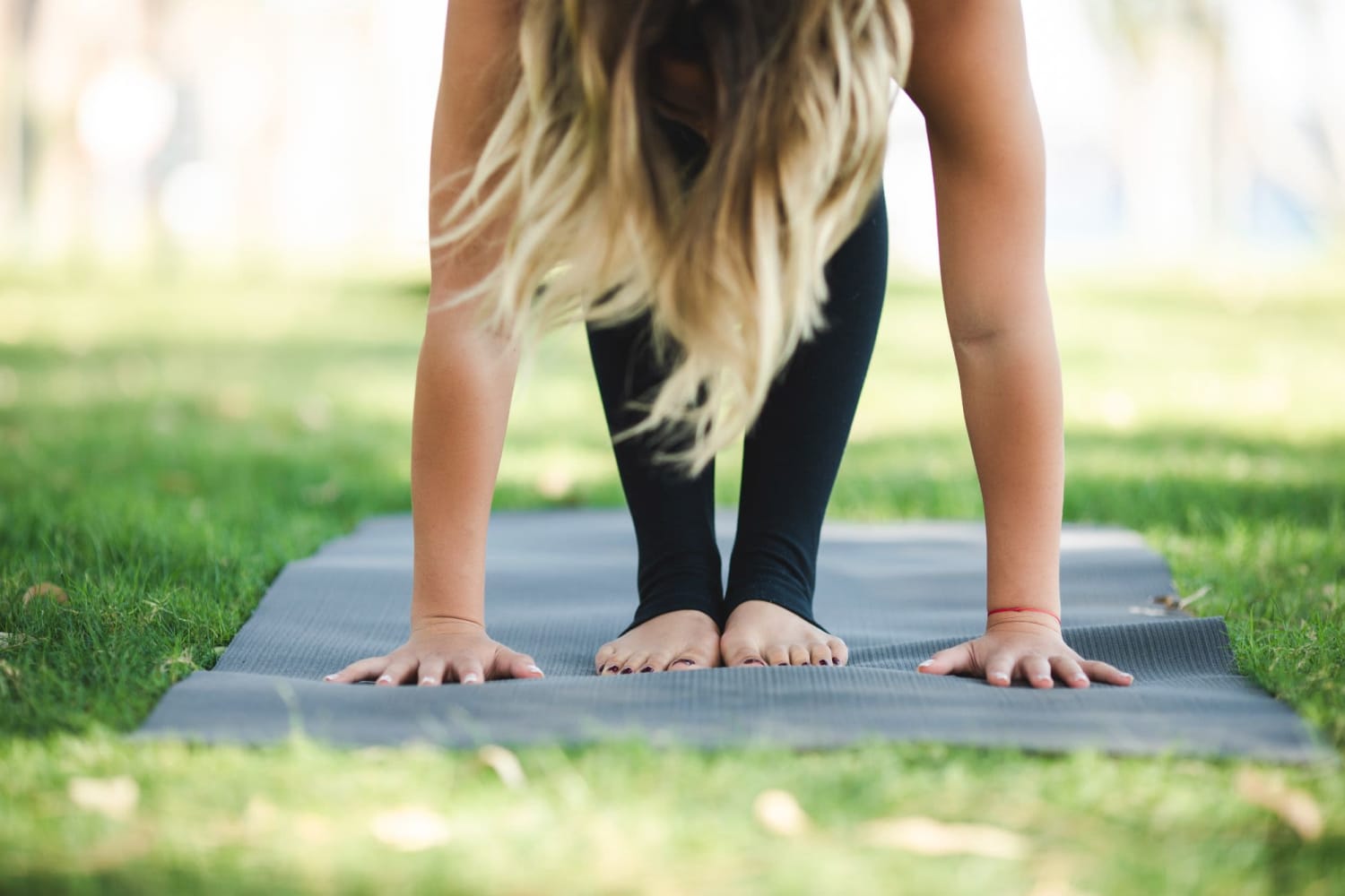 Resident doing yoga in a park near Wisdom Place in Modesto, California
