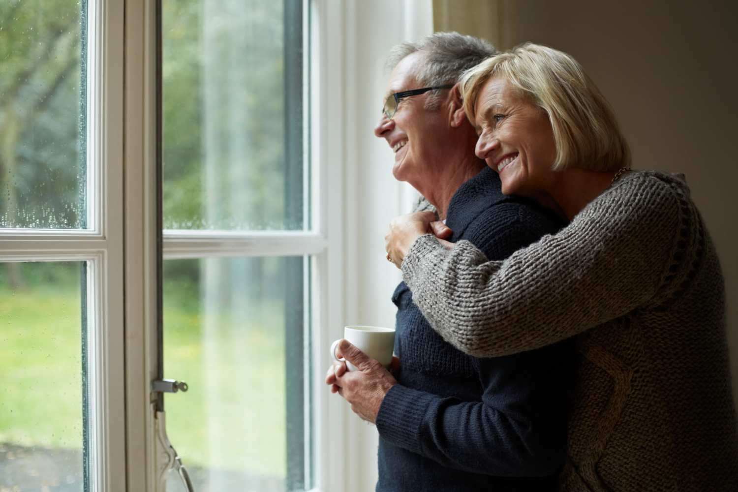 Resident couple enjoying the community view at Indian Terrace Senior Apartments in Auburn, Indiana