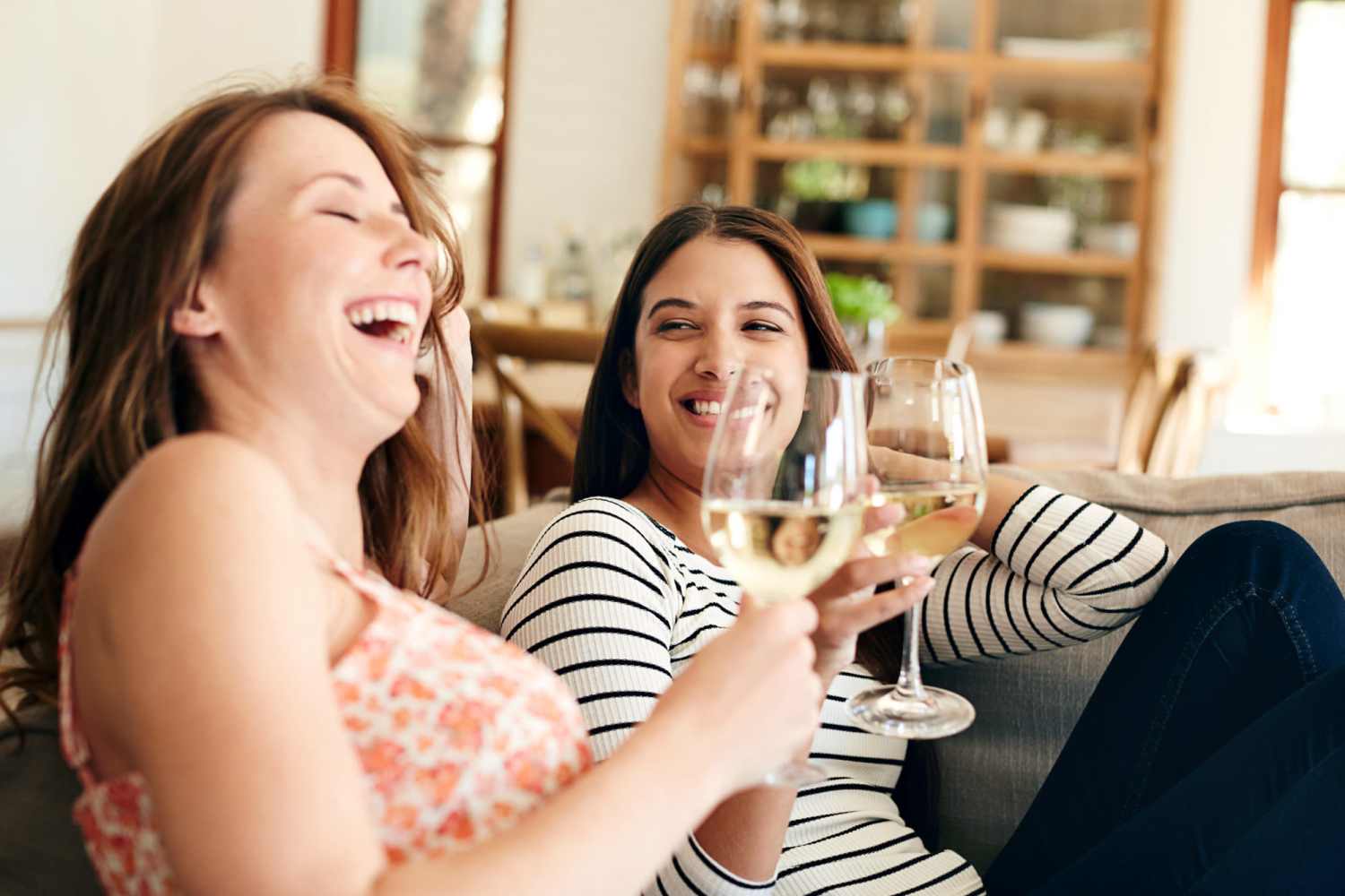 Happy resident enjoying drink in their apartment at Woodland Glen Apartments in Grabill, Indiana