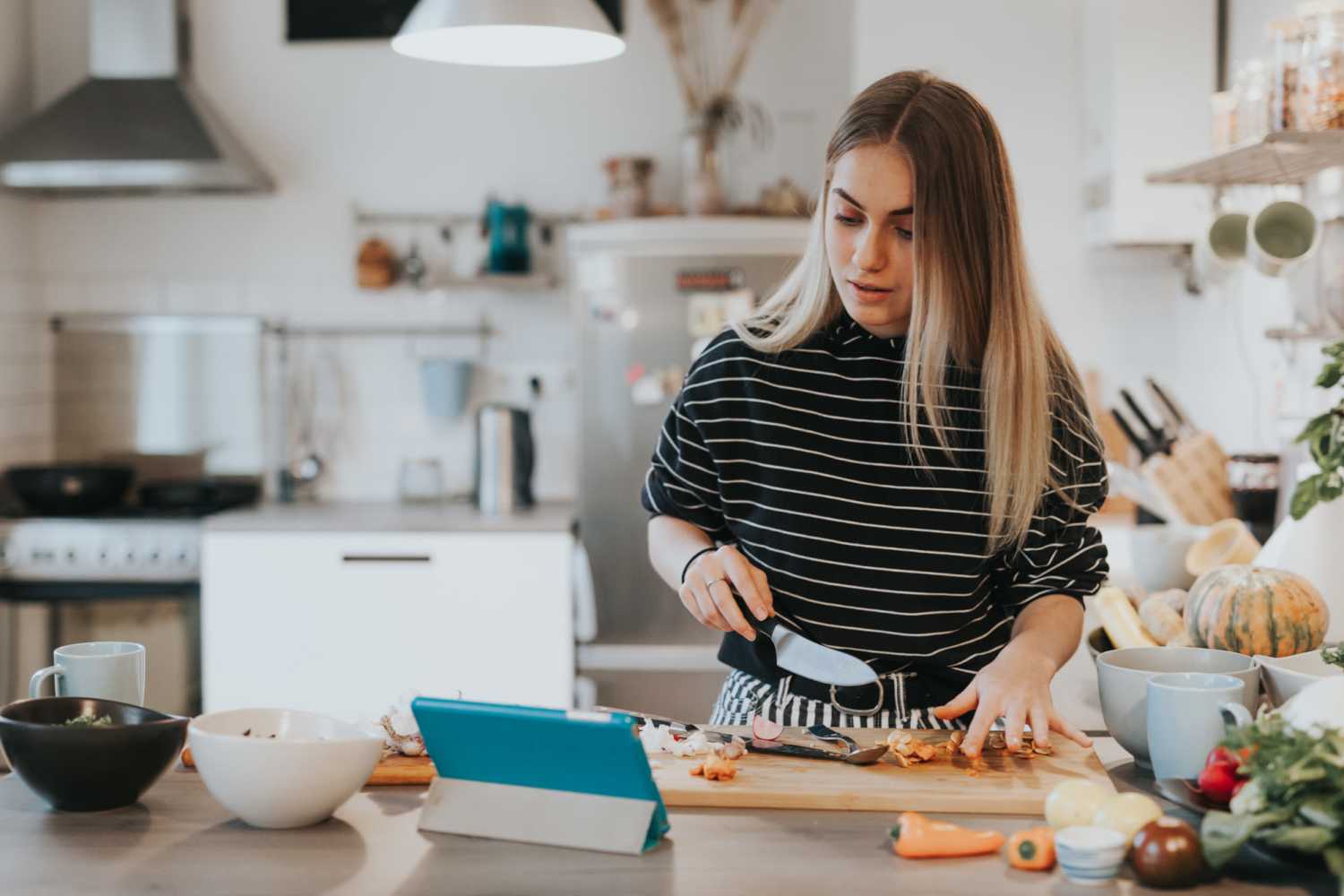 Resident cooking in kitchen at Oxford Heights in Greenville, Ohio