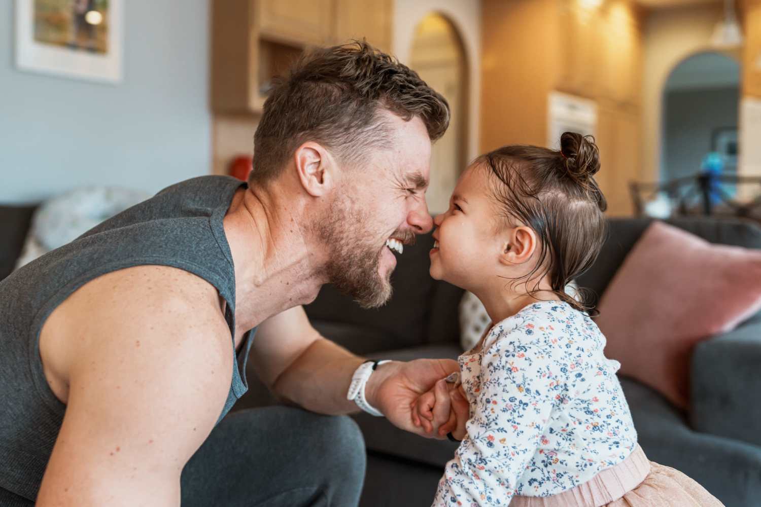 A man and a little girl showcasing a moment of affection and love between them at Carriage Town Square in Flint, Michigan