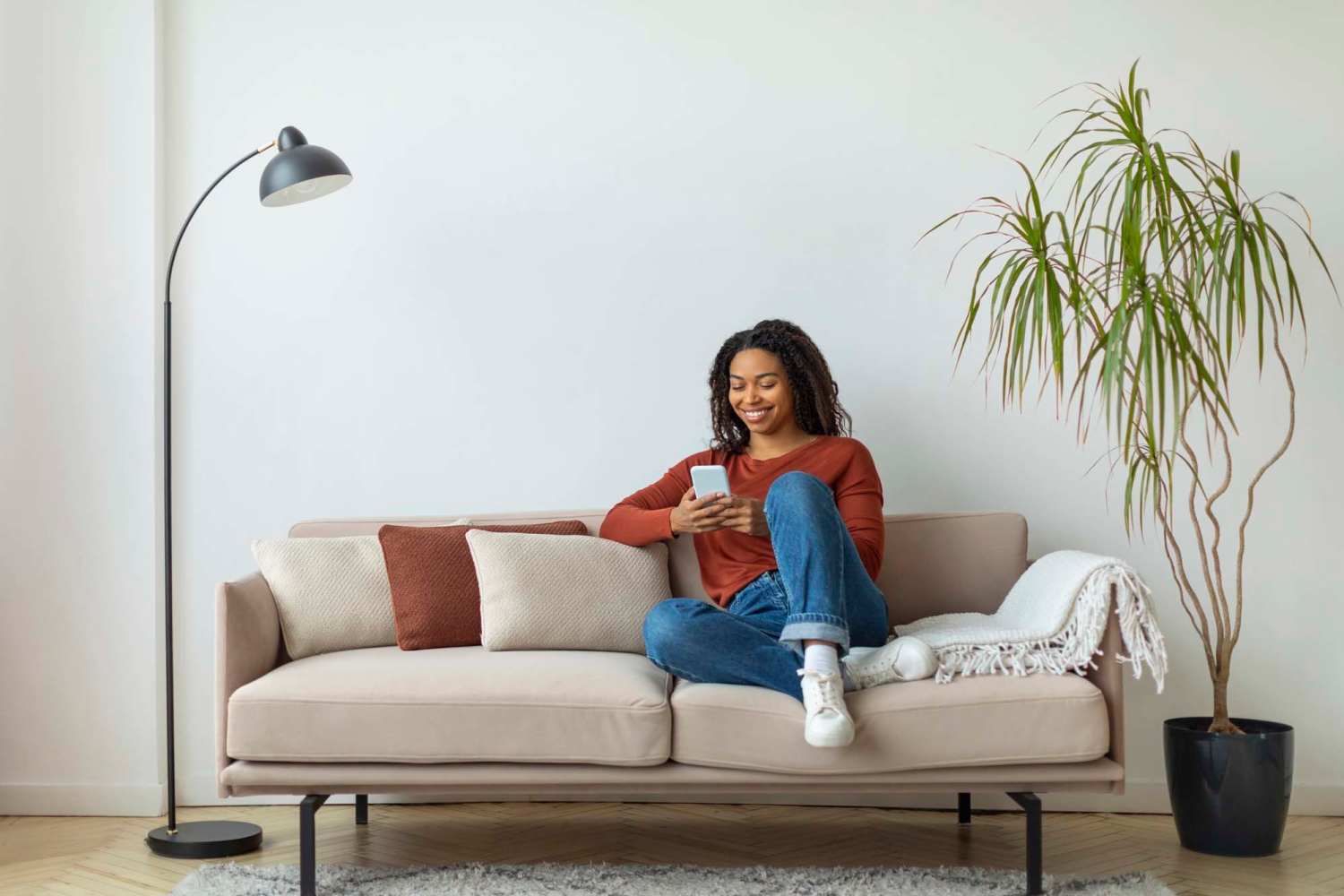 Women sitting in a living room at Westbury Apartments in Wayland, Michigan