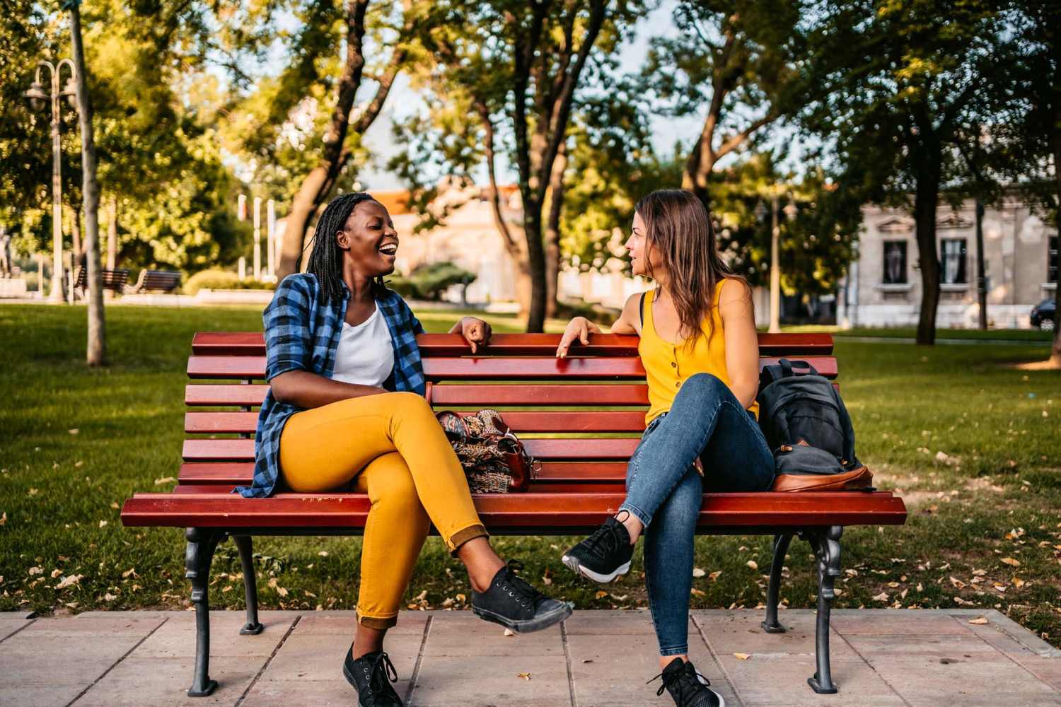 Residents having a chat while sitting on a park bench near Middlebrook Trace II in Staunton, Virginia