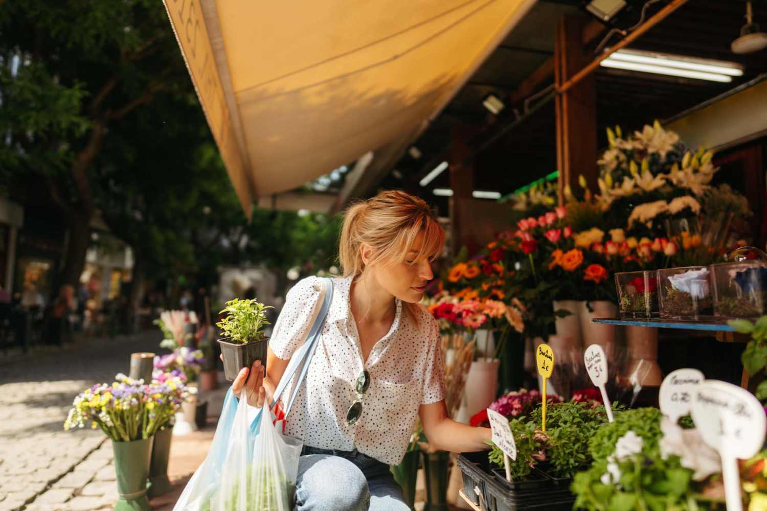Resident buying flowers near Arbor Park Apartments in Hurst, Texas