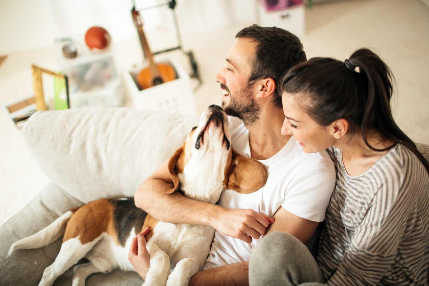 Happy dog and a resident couple in their apartment at Icon Apartments in San Antonio, Texas