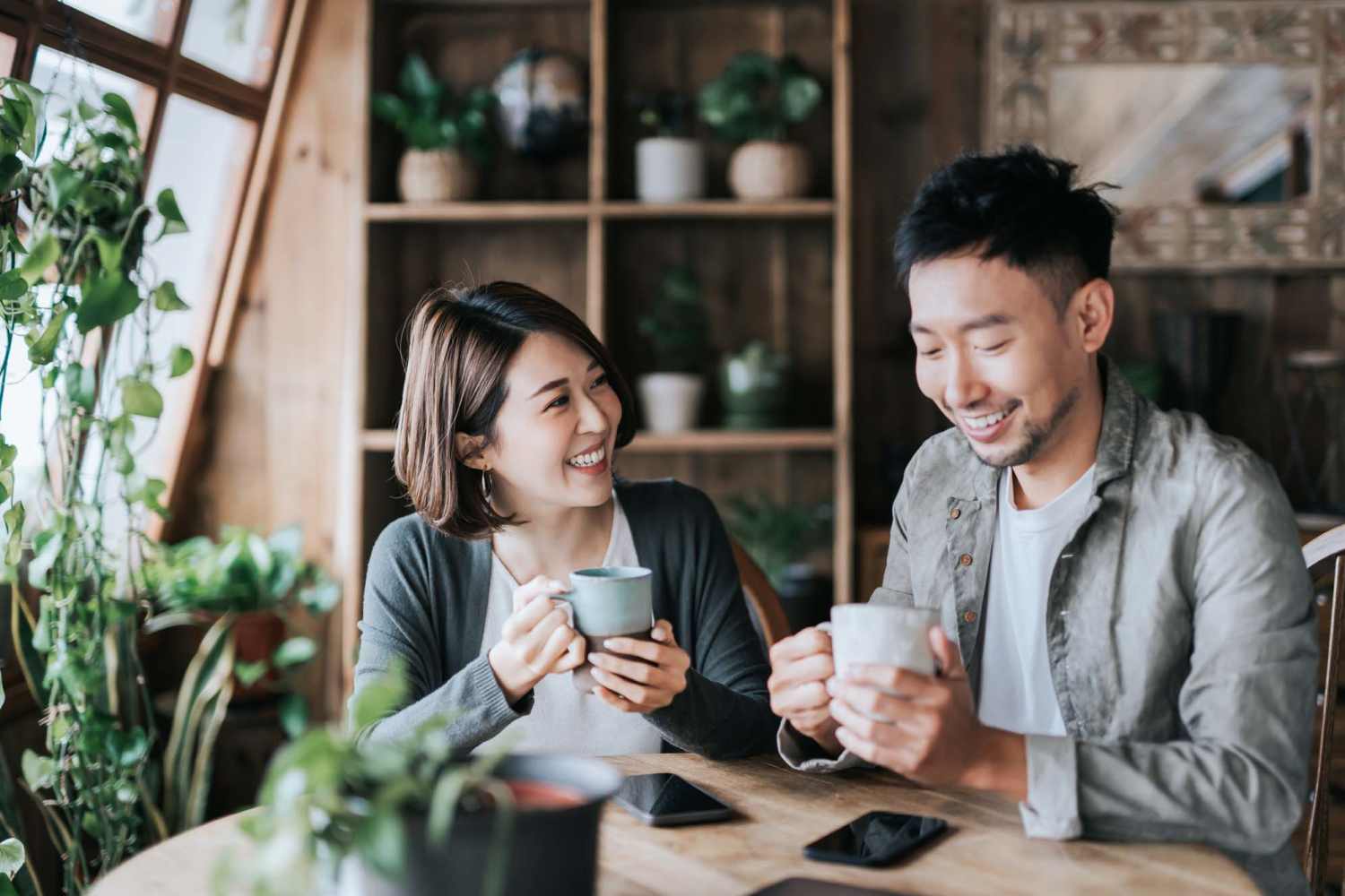 Couple drinking coffee at a cafe near Harborside Marina Bay Apartments in Marina del Rey, California