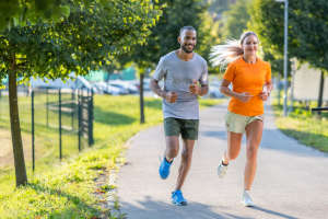 A resident couple on a jog in a park near Andanté in Seattle, Washington