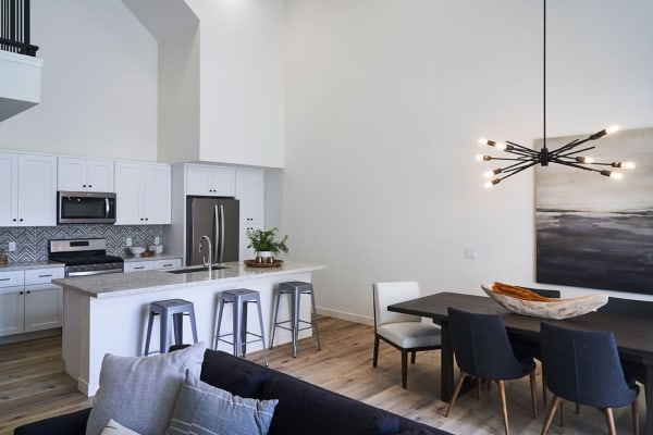 Beautiful open-concept layout with hardwood floors in a model home at Novella at Biltmore in Phoenix, Arizona