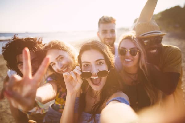 Friends gather for fun at the beach near Courtyard in Hayward, California