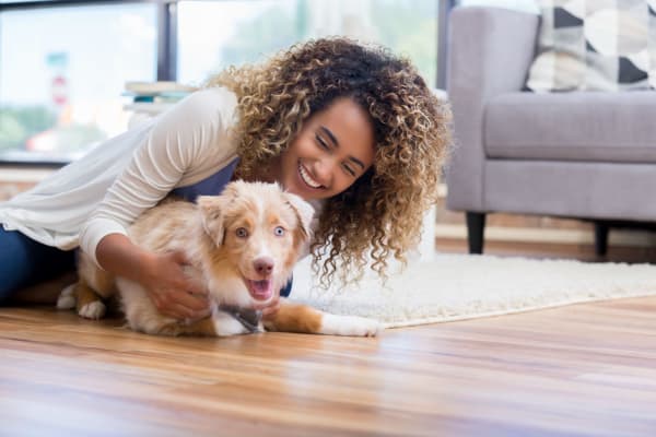 Resident hugging their dog at Isles in Roseville, California