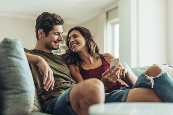 Couple relaxing in their home at Isles in Roseville, California