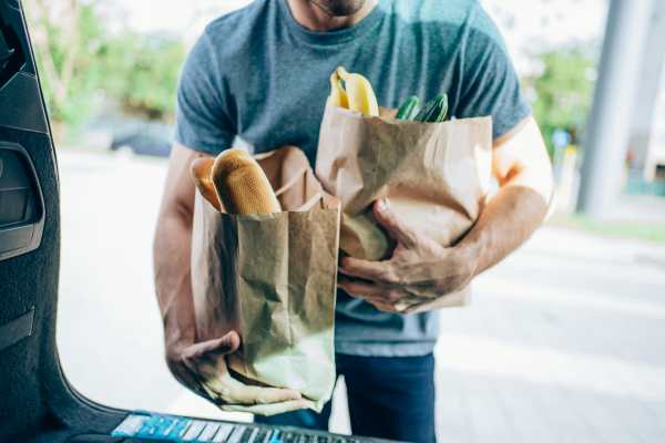 Resident unloading groceries at Casa Aliento in Oxnard, California