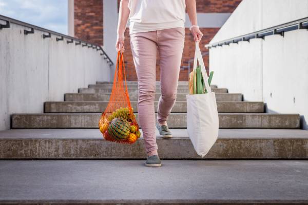 Resident carrying groceries near Waters Edge in Sacramento, California