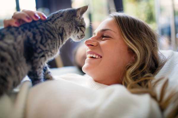 Happy cat and her owner in their new home at Westmont Village in Charlotte, North Carolina