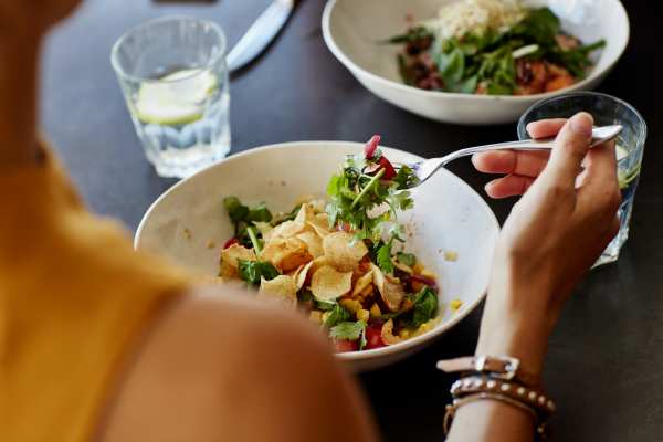 Resident eating vegetable salads at New Village At Hermitage in Hermitage, Tennessee