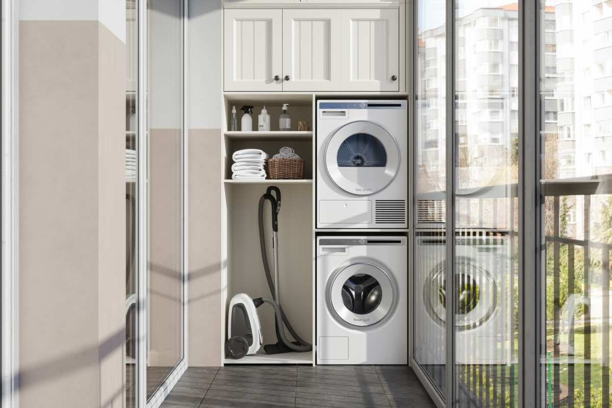 Woman putting laundry in the washer at Hoff Mall and Hoff Apartments in Mount Horeb, Wisconsin
