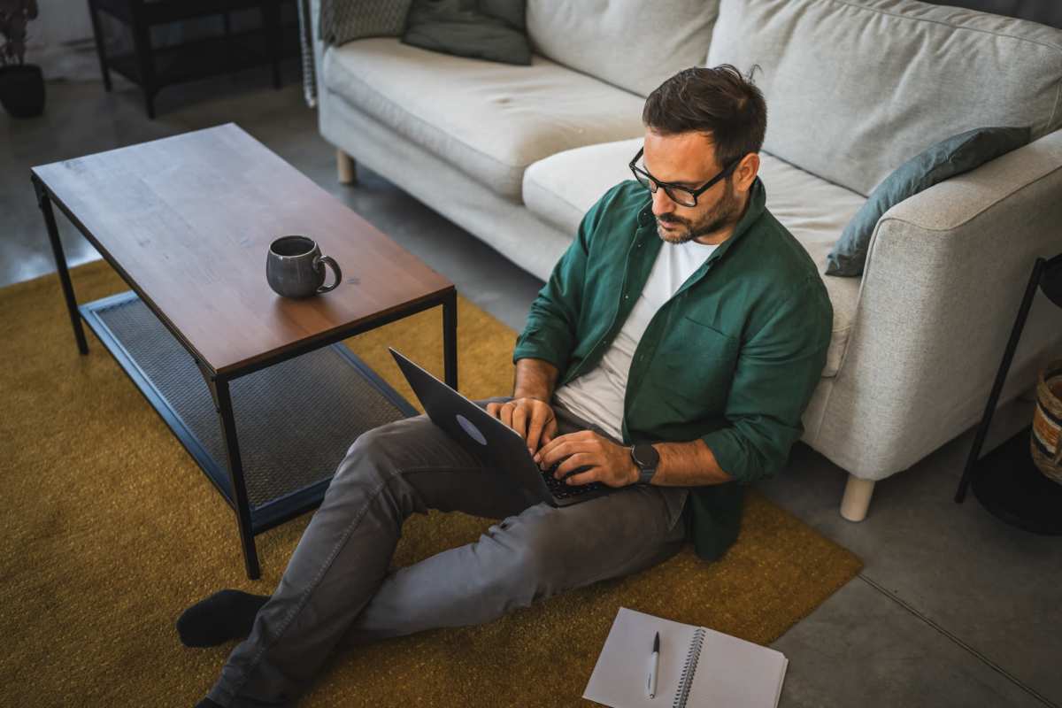 A resident at home on his laptop at Nottingham Village in Gardner, Kansas
