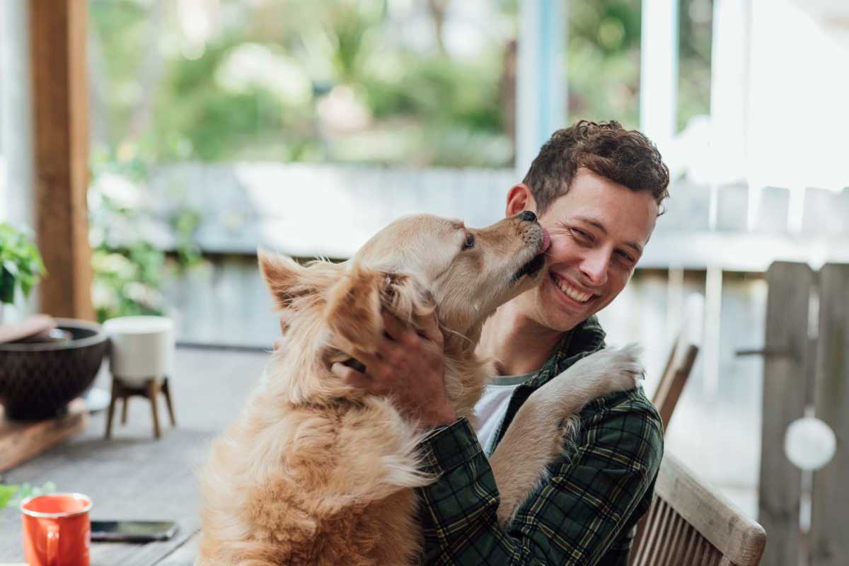Resident playing with his dog at Juniper Pointe in Kaufman, Texas 