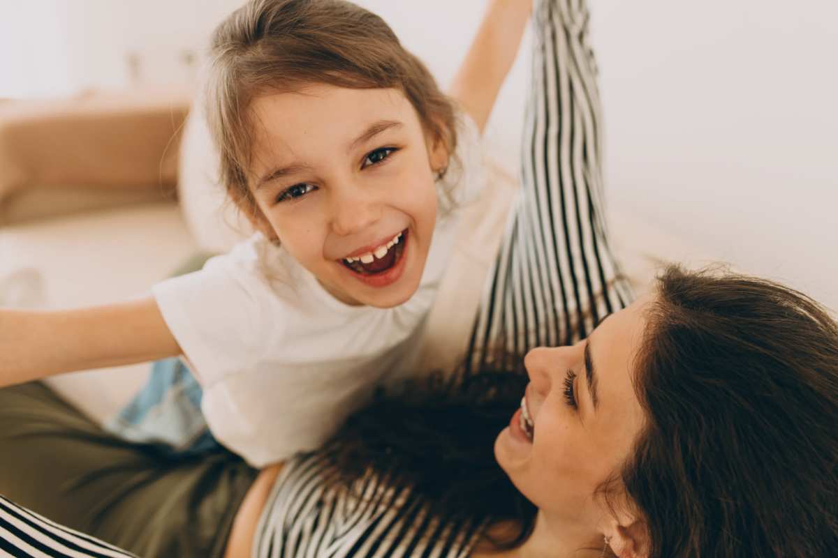 Resident and her daughter playing in their home at Riverside Park in Early, Texas