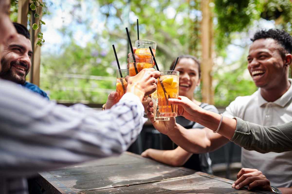 Friends raising a drinks to the good life at Crescent Landing in Greenville, South Carolina