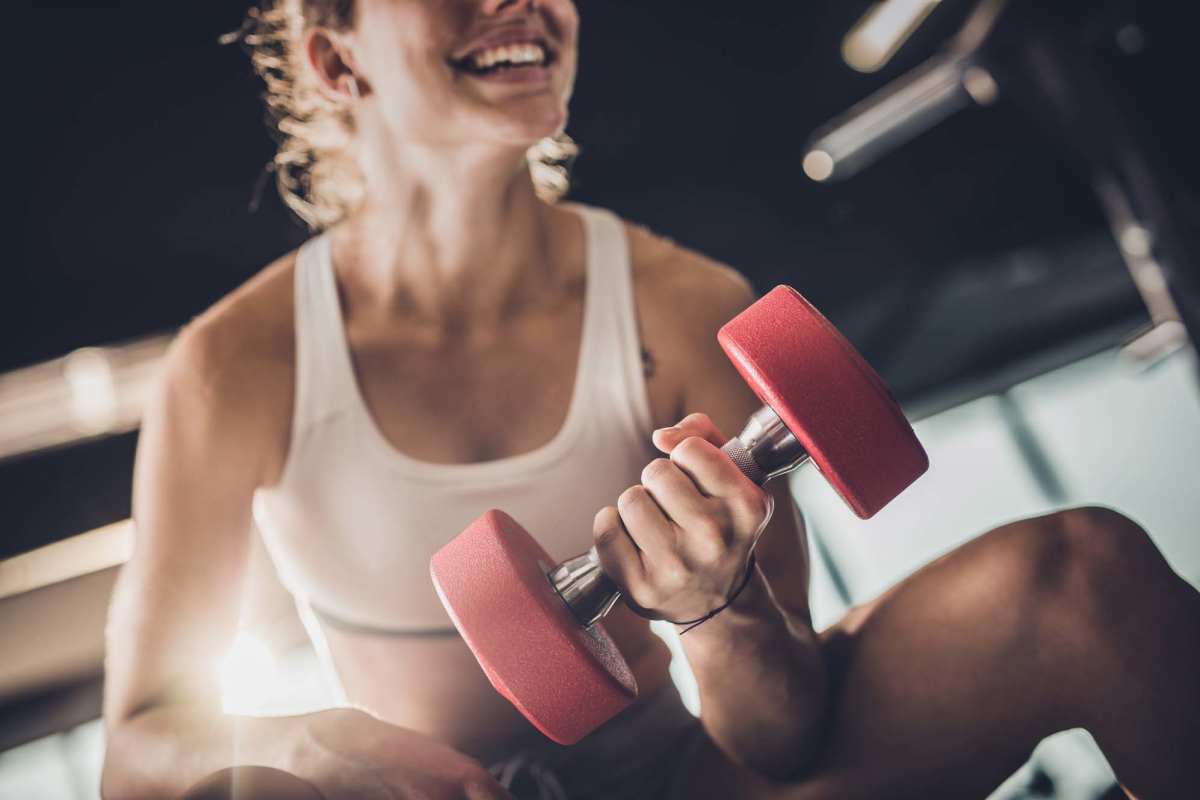 Resident working out in the fitness center at Butterfield Commons in Maricopa, Arizona