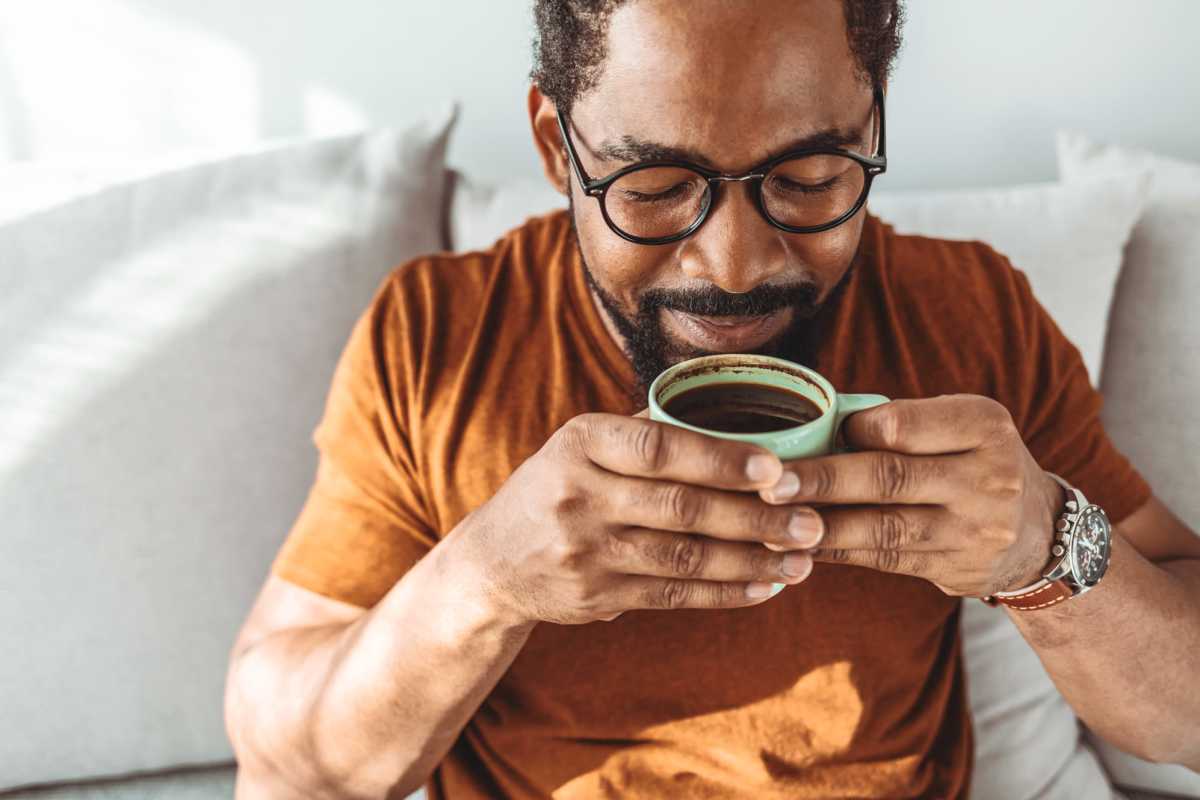Resident drinking coffee at Butterfield Commons in Maricopa, Arizona