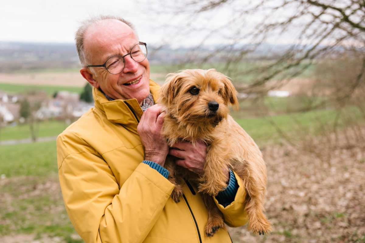 Resident with his cute dog at The Willows Senior Community in Bowie, Maryland 