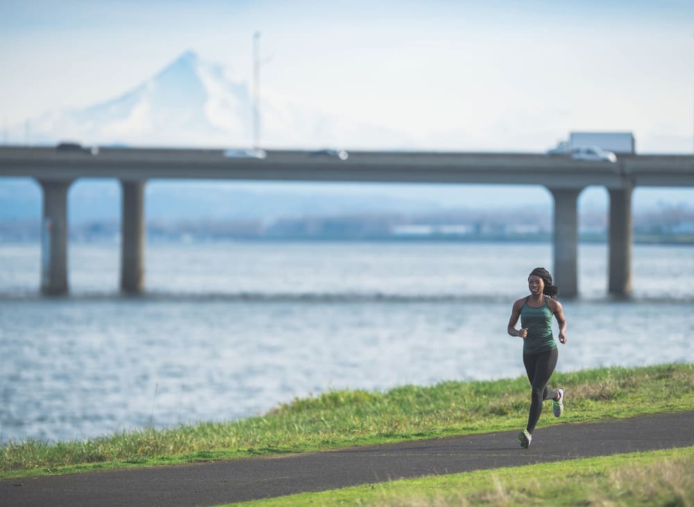 A women on a jog along the waterfront near Ambrose in Bremerton, Washington