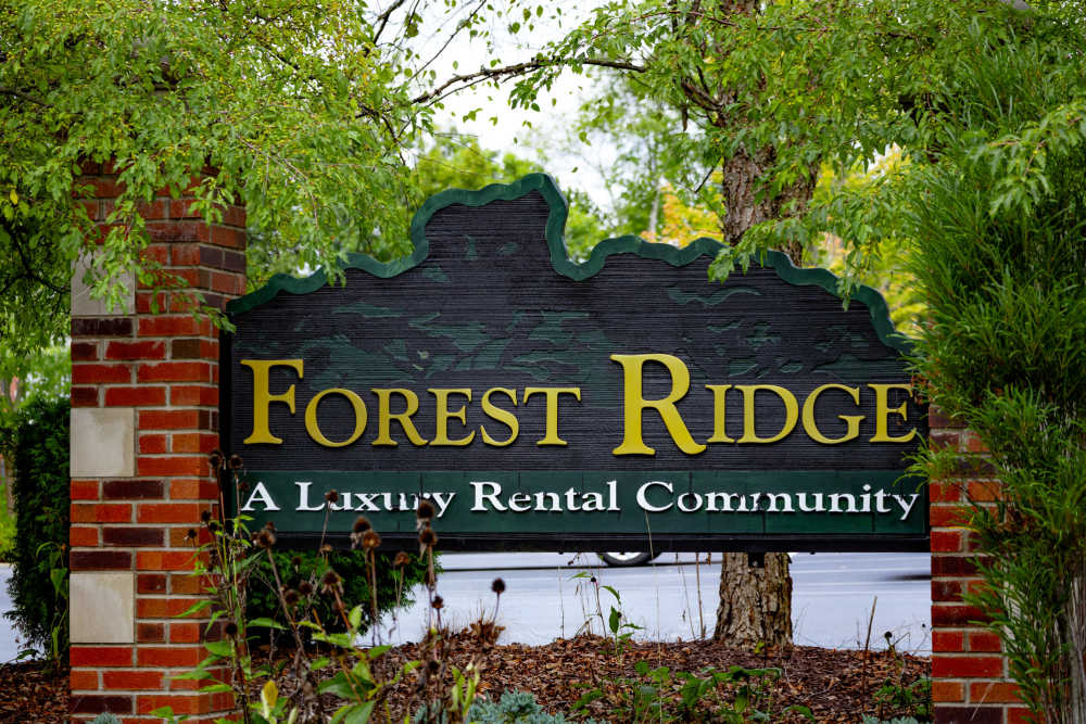 Front entrance sign of community grass and walking paths at Forest Ridge in Bloomington, Indiana, 