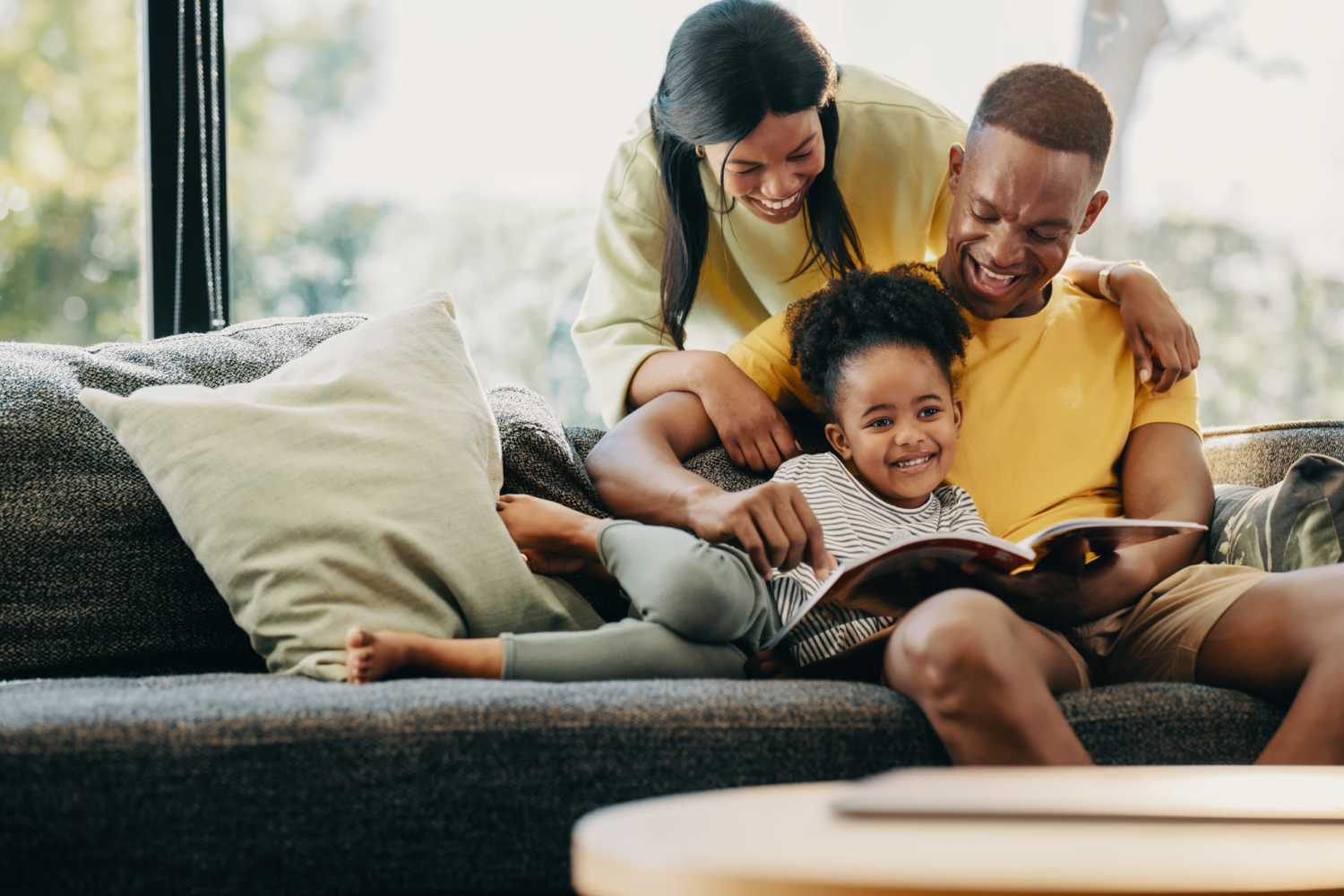 A lovely kid enjoying her story time with her parents at Delta Villas in Delta, Ohio