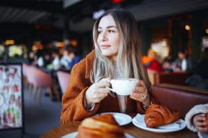 Resident woman enjoying coffee near Canton Lakeside Village in Canton, Texas