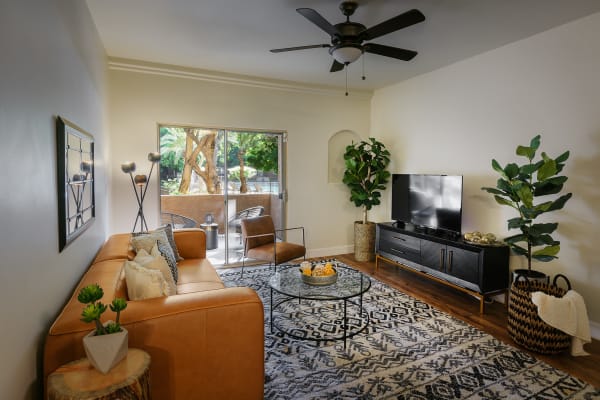 Living room with sliding glass door at The Regents at Scottsdale in Scottsdale, Arizona