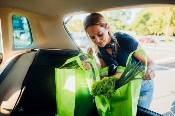 Resident keeping the shopping bags in her car near Westmont Village in Charlotte, North Carolina