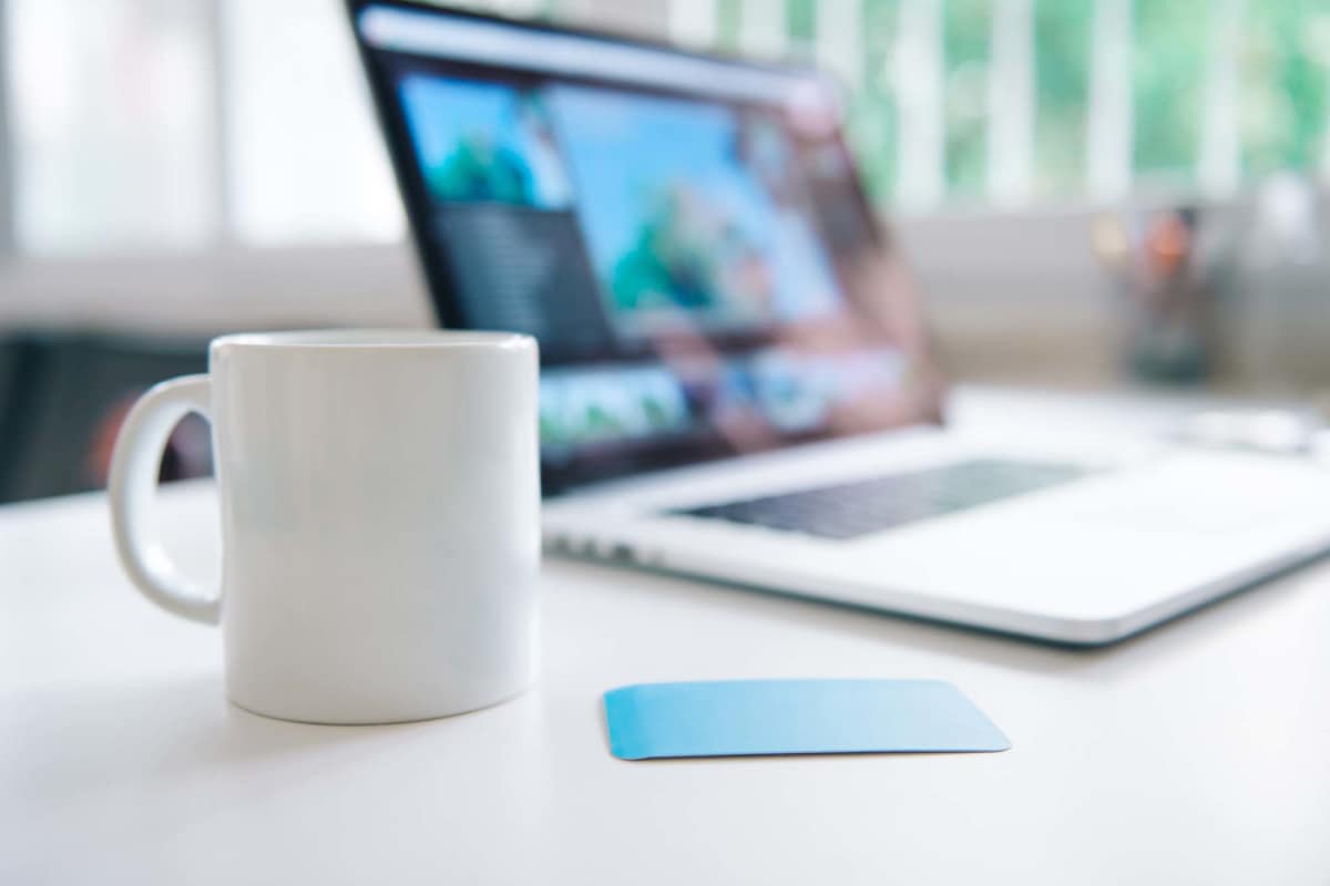 Laptop and coffee mug at Millbrook Apartments in Shreveport, Louisiana