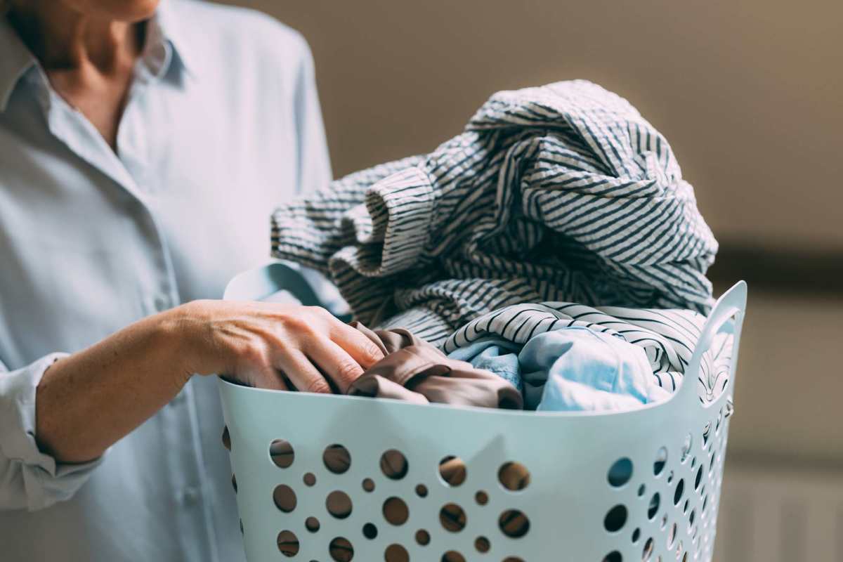 Woman going for laundry at Gateway Terrace Apartments in Sun Prairie, Wisconsin