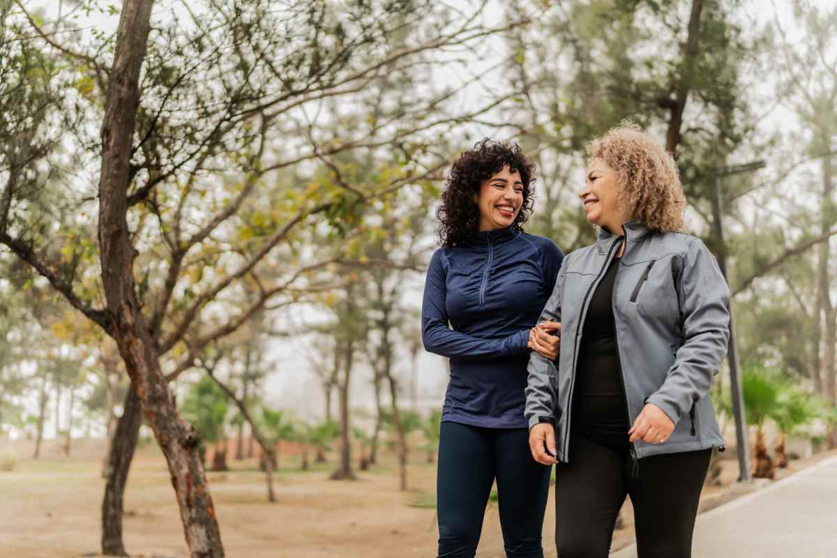 Residents walking in park near at Palm Garden in Orange, Texas