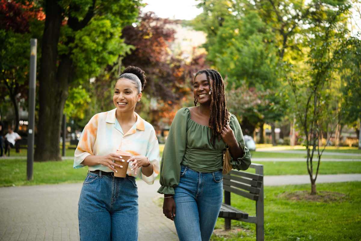 Resident walking in park near Valley Creek Apartments in Hurst, Texas
