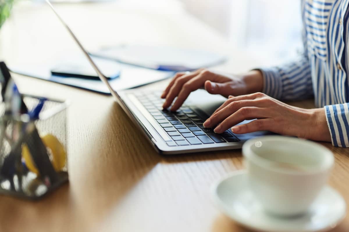 Contact us resident using laptop at Timber Run in Spring, Texas
