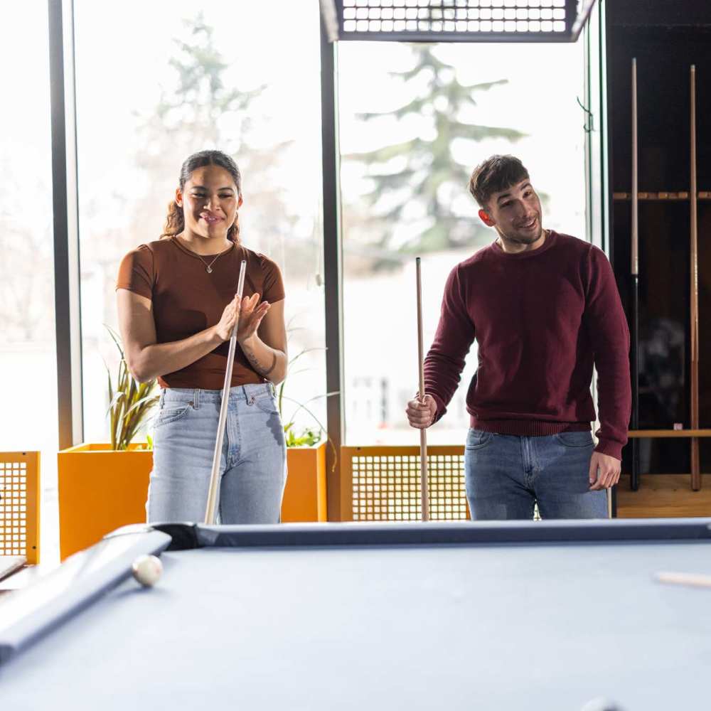 Billiards table with friends playing at Alton Park in Fort Worth, Texas