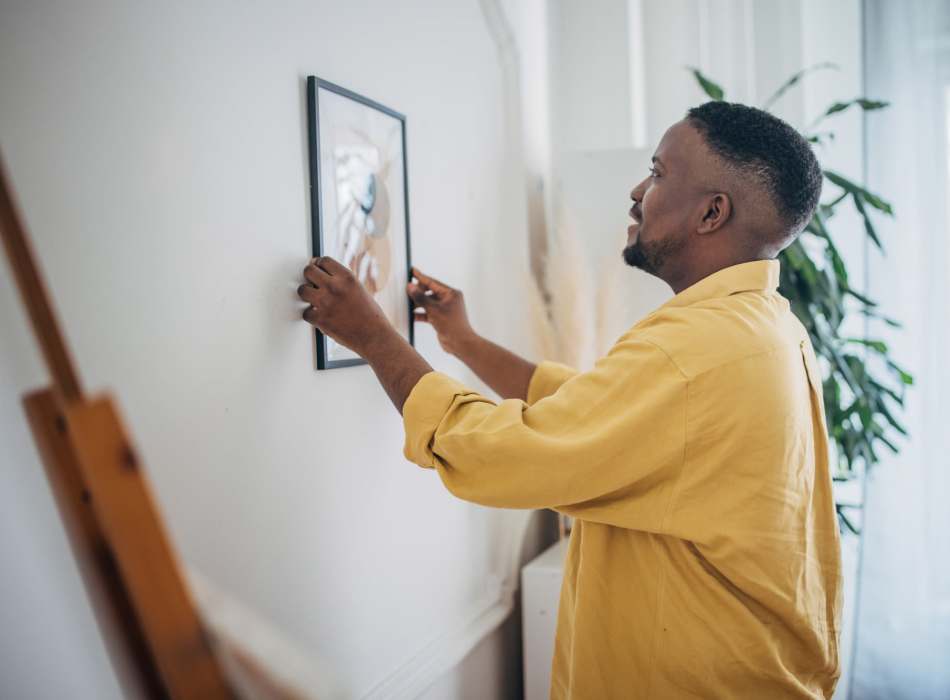 Resident adjusting frame at Breckinridge Point Apartments in Richardson, Texas