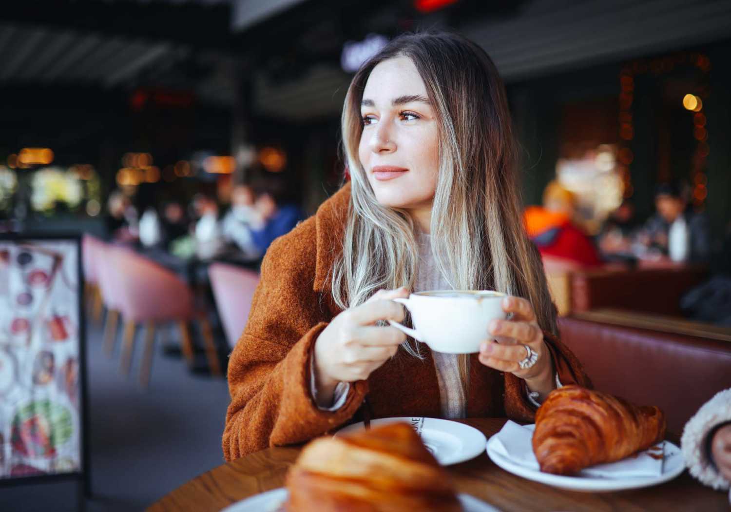 Resident having coffee at a cafe near Red Knot at Edinburgh in Chesapeake, Virginia