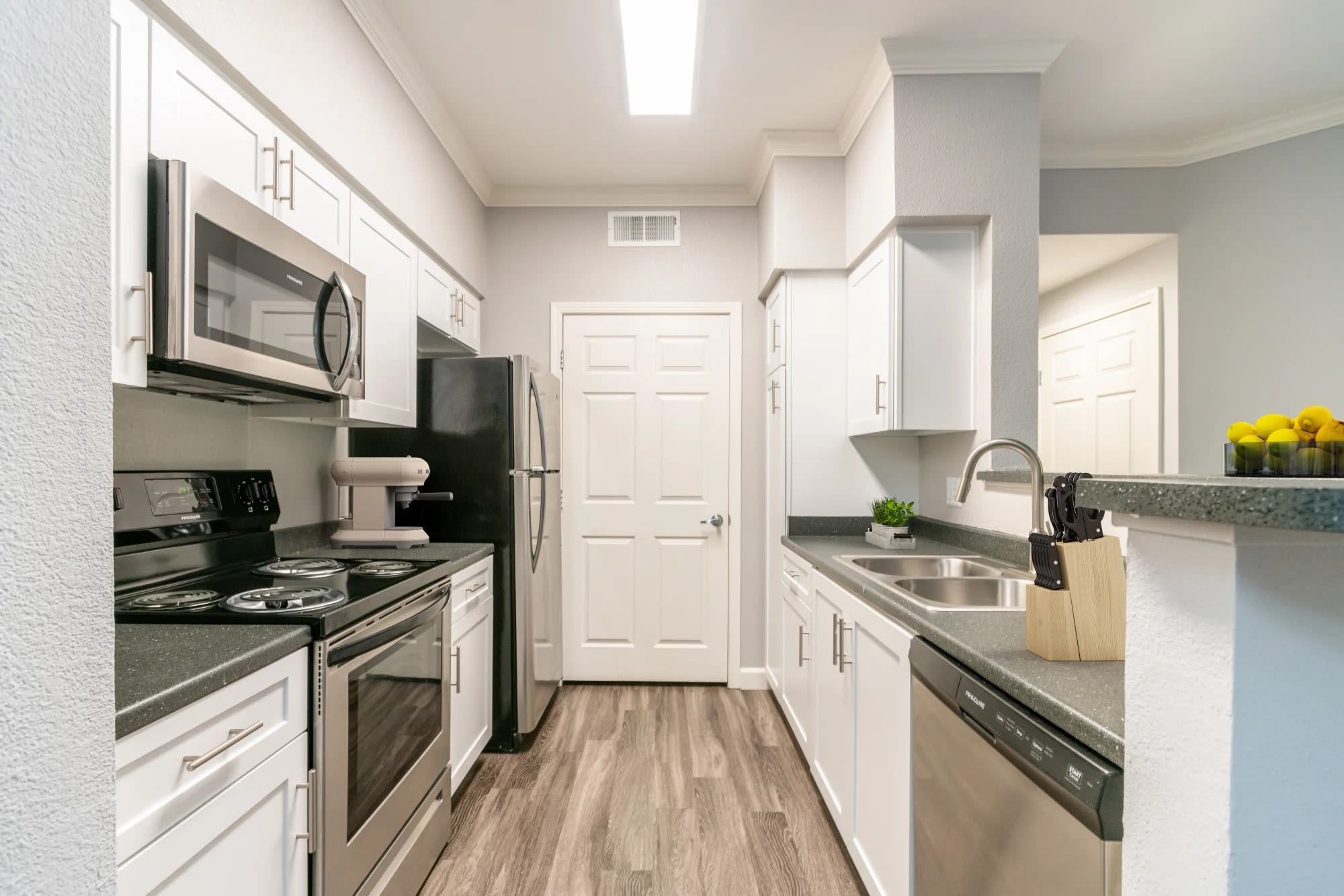Kitchen with stainless-steel appliances at Hawthorn Village Apartments in Napa, California