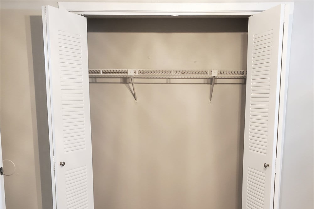 Open closet in a bedroom at Pebble Creek Apartments in Antioch, Tennessee